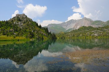 Sary-Chelek lake with mountains clipart