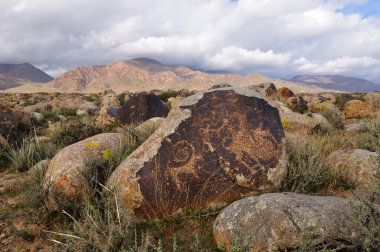 Stones with ancient petroglyphs clipart