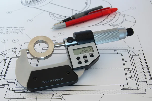 Micrometer on technical drawing — Stock Photo, Image