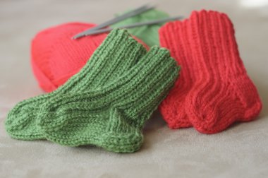 Knitted baby socks clipart