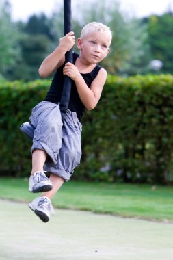 Boy using the cable-way clipart