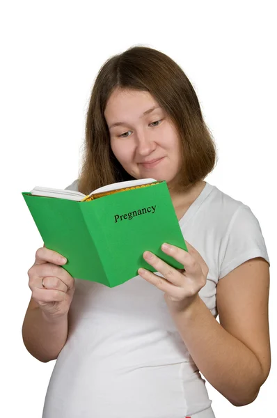 Schwangere Liest Buch Über Schwangerschaft Über Weiß — Stockfoto