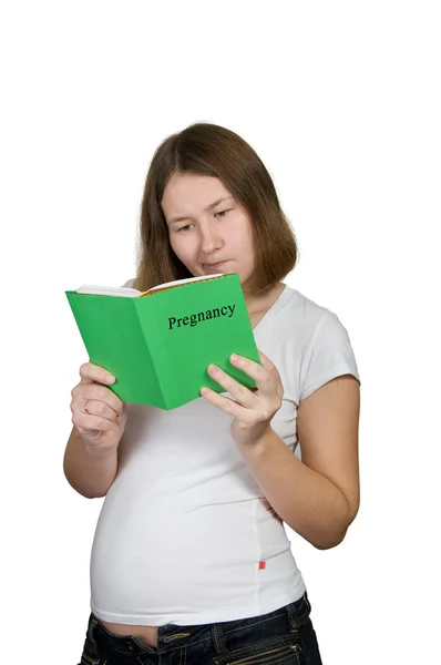 Mujer Embarazada Está Estudiando Manual Sobre Blanco —  Fotos de Stock