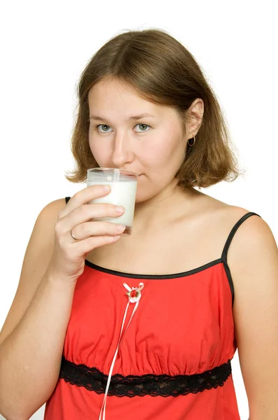 Mujer Joven Está Bebiendo Leche Sobre Blanco — Foto de Stock