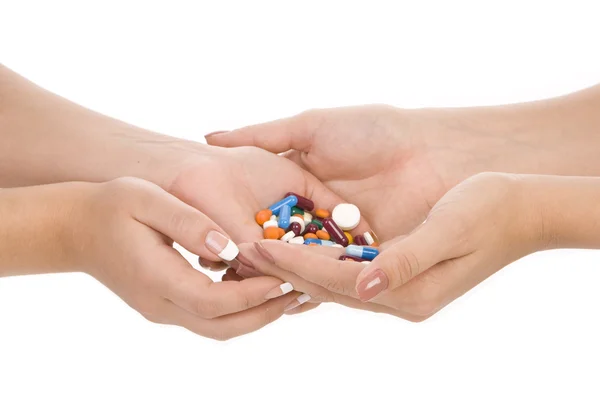 Léky v rukou žen — Stock fotografie