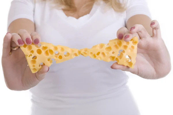 stock image Two triangular slices of cheese in the hands of a girl