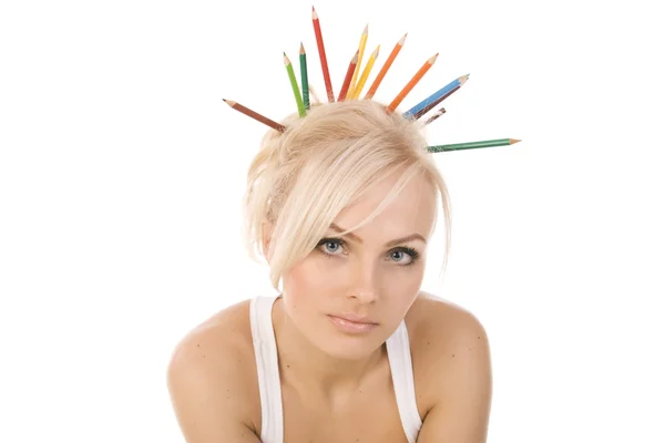 Mycket vacker blondin med en massa färgade pennor på vit bakgrund — Stockfoto