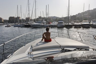 France, Corsica, Porto Vecchio, entering the Porto Vecchio marina on a luxu clipart