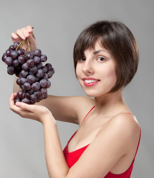 Chica con un ramo de uvas —  Fotos de Stock