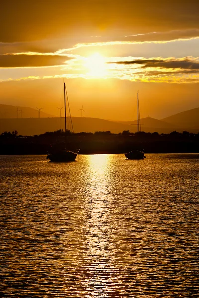 stock image Two sailboats anchored at sunset