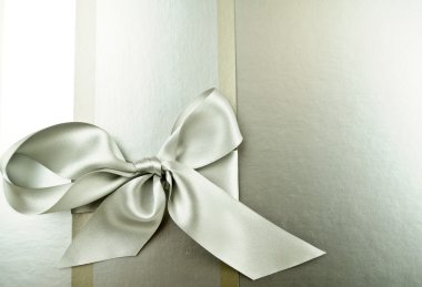 Silver ribbon on a silver buckground clipart