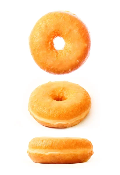 Три пончики в різних положеннях — стокове фото