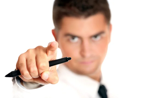 Young businessman pointing at someone — Stock Photo, Image