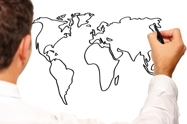 Young businessman drawing a world map — Stock Photo, Image
