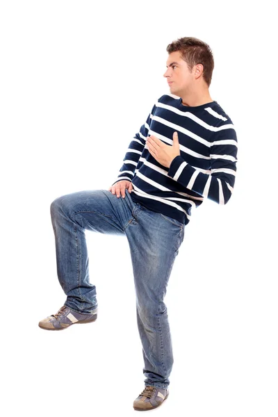 Young man standing on one leg — Stock Photo, Image