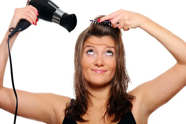 Mladá žena sušení vlasů — Stock fotografie