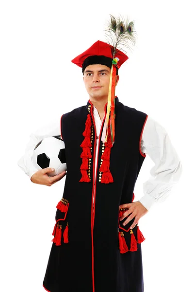 Польский мужчина в традиционном костюме с футболом — стоковое фото