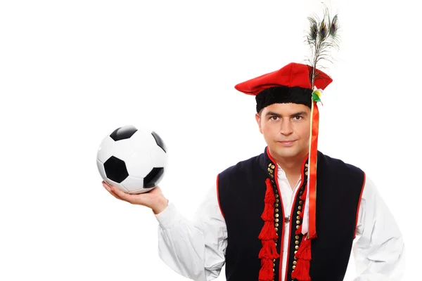 stock image Polish man in a traditional outfit with football