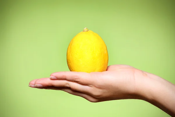 stock image Lemon over green