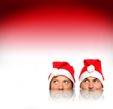 Santas over red background clipart