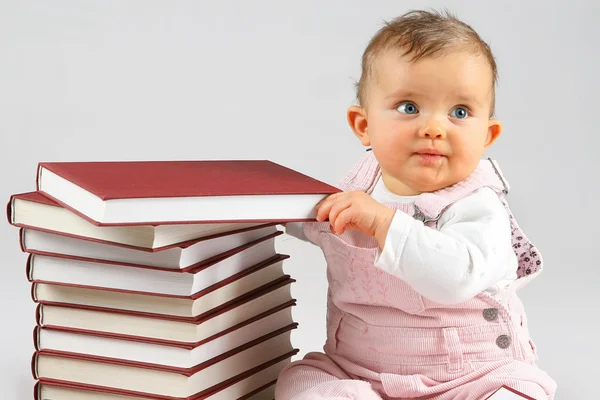 Small baby and books — Stock Photo, Image