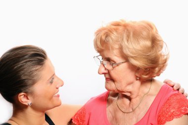 A picture of grandmother and granddaughter talking over white background clipart