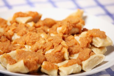 A picture of typical Polish cheese dumplings with breadcrumbs clipart