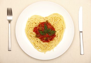 A picture of fresh spaghetti in the shape of a heart for Valentine's day clipart