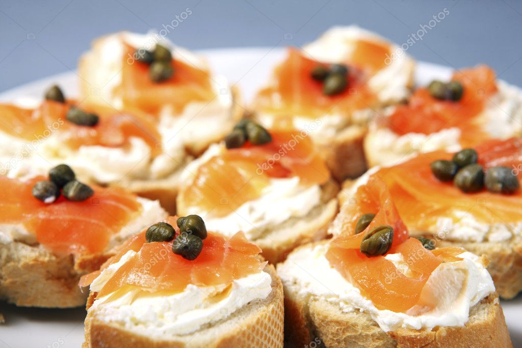 A close-up of traditional jewish sandwiches with cream cheese, salmon and capparis