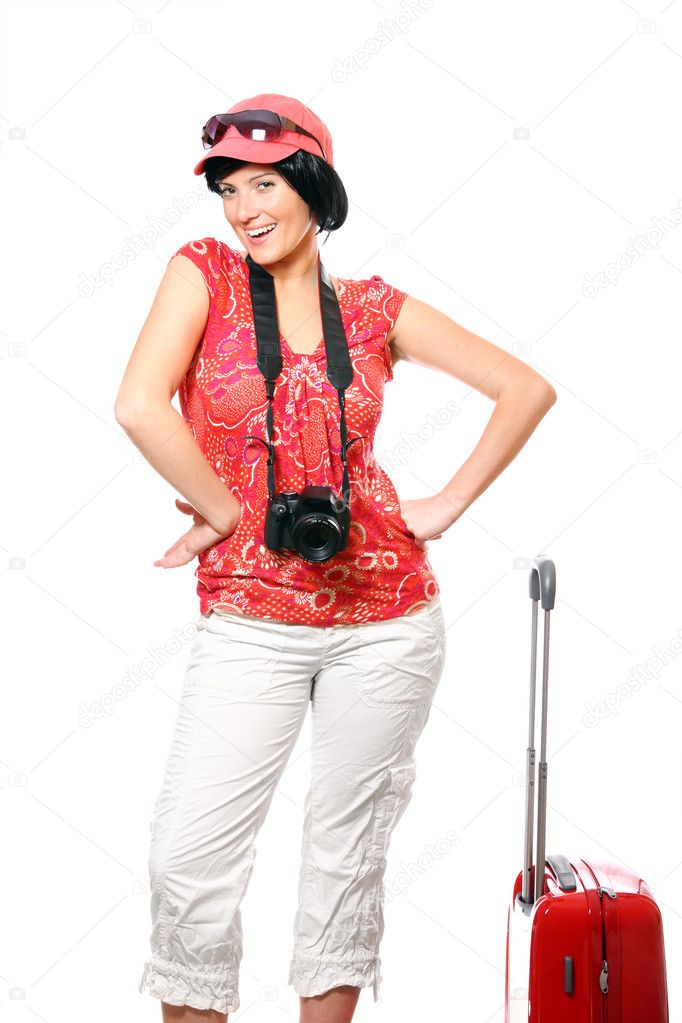 A picture of a happy woman with camera and suitcase ready to go on holidays