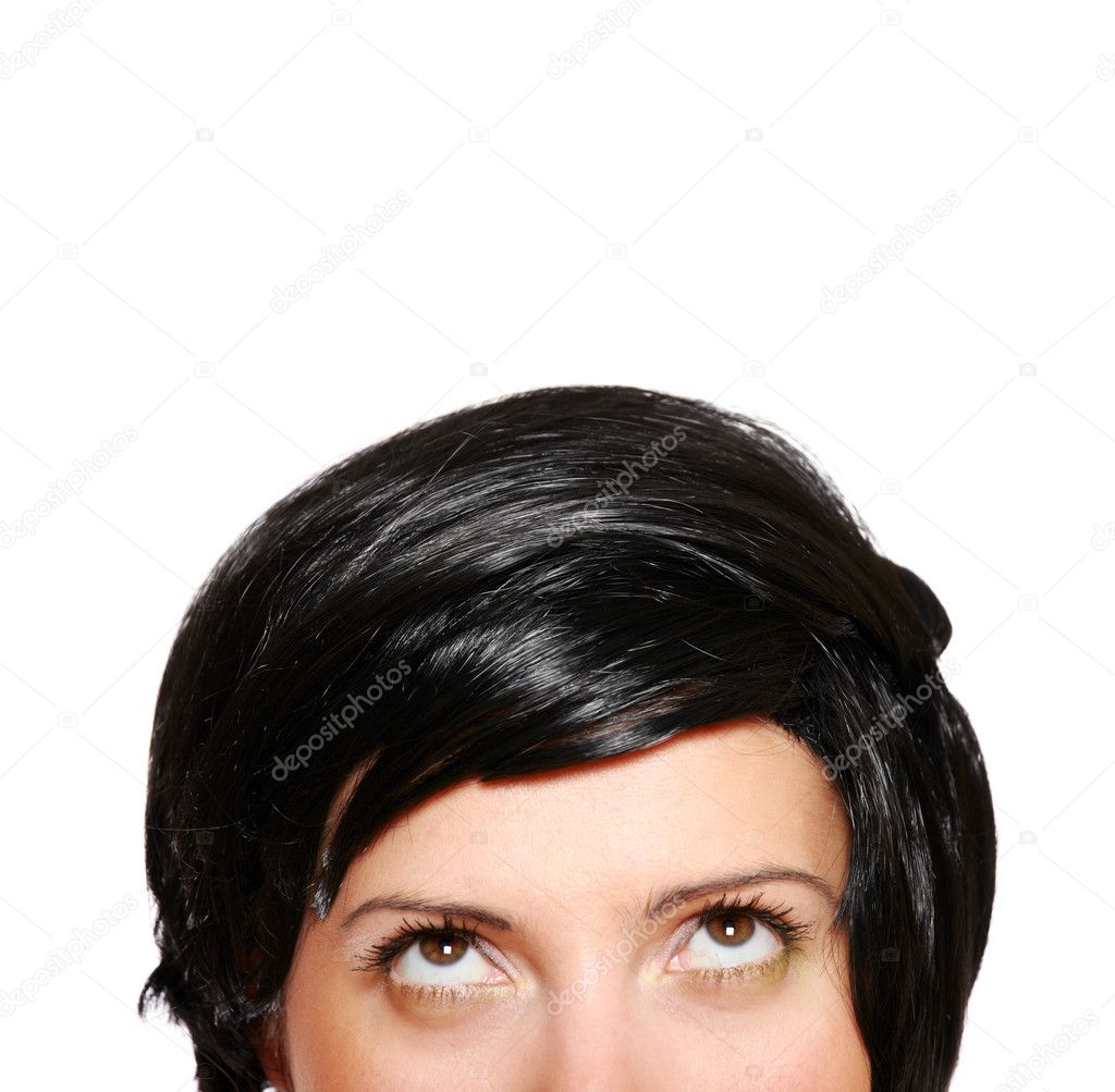 A picture of a woman in short black hair looking up over white background