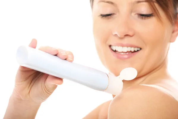 Woman using body lotion — Stock Photo, Image