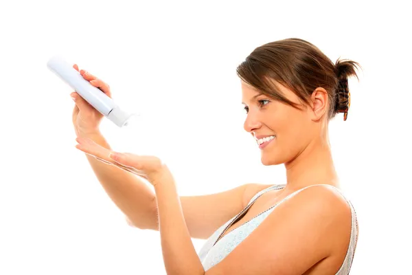 Young woman using body lotion — Stock Photo, Image