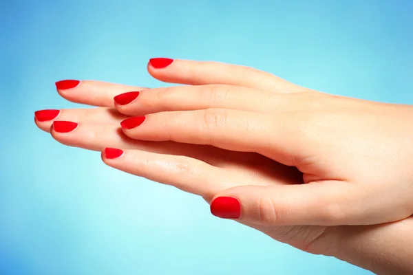 Hands over blue background — Stock Photo, Image