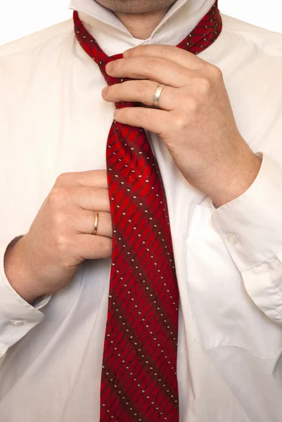 stock image The man fastens a tie