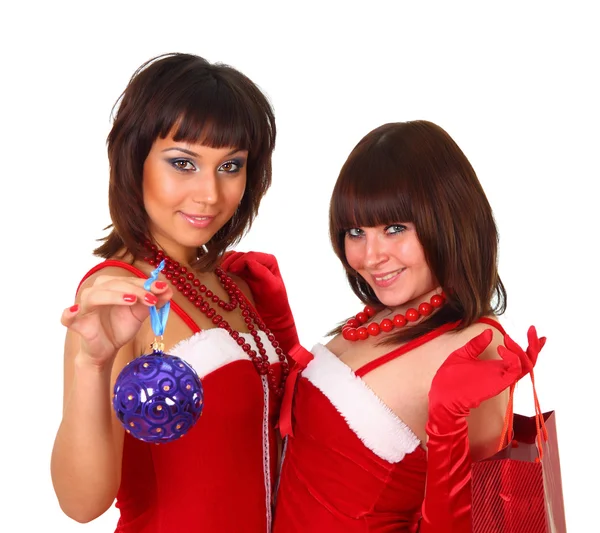 Две девушки в платье Санты с рождественским декором и сумкой — стоковое фото