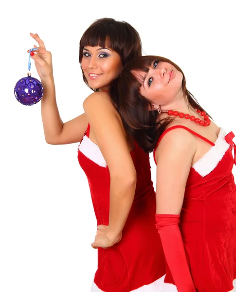 Δύο κορίτσια στη Σάντα φόρεμα με διακόσμηση Χριστουγέννων — Φωτογραφία Αρχείου