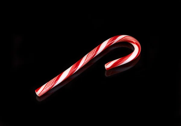 Candy cane on black — Stock Photo, Image