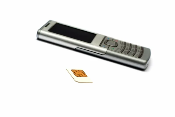 Telefon i sim karta — Zdjęcie stockowe