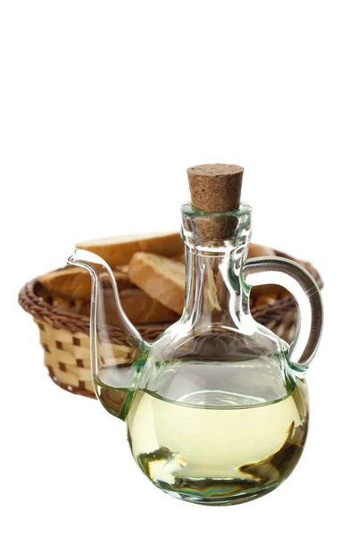 Olívaolaj, egy átlátszó üveg és a kenyér Stock Kép