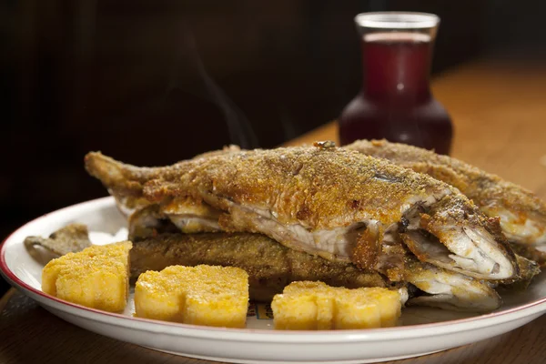Baked rainbow trout with polenta — Stock Photo, Image