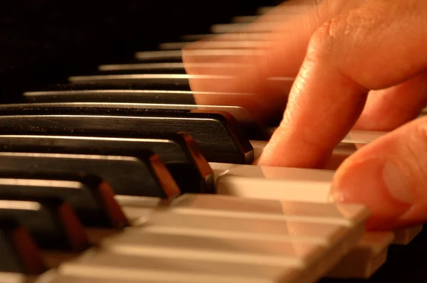 stock image Mans hands playing piano