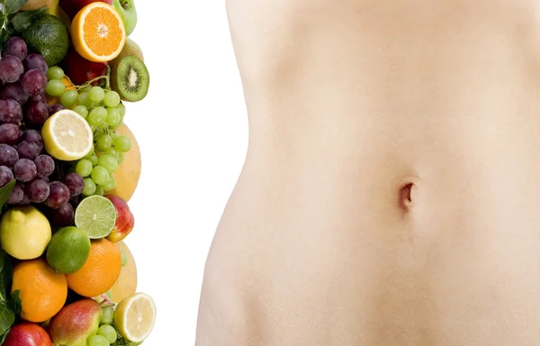 Vrouwelijke mooie lichaam en vers fruit — Stockfoto