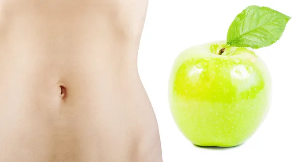Beautiful female body and green apple — Stock Photo, Image