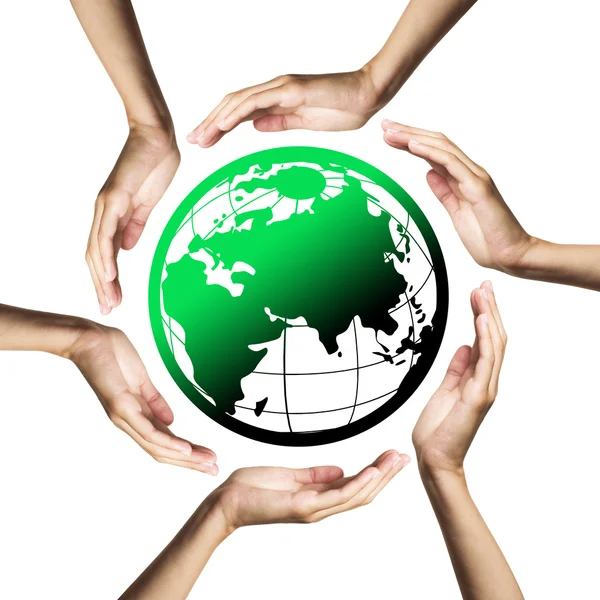 Groene planeet (aarde) omgeven door handen Stockfoto