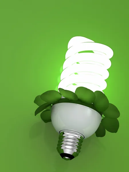 Концепция лампы энергосбережения флуоресцентный с листьями — стоковое фото