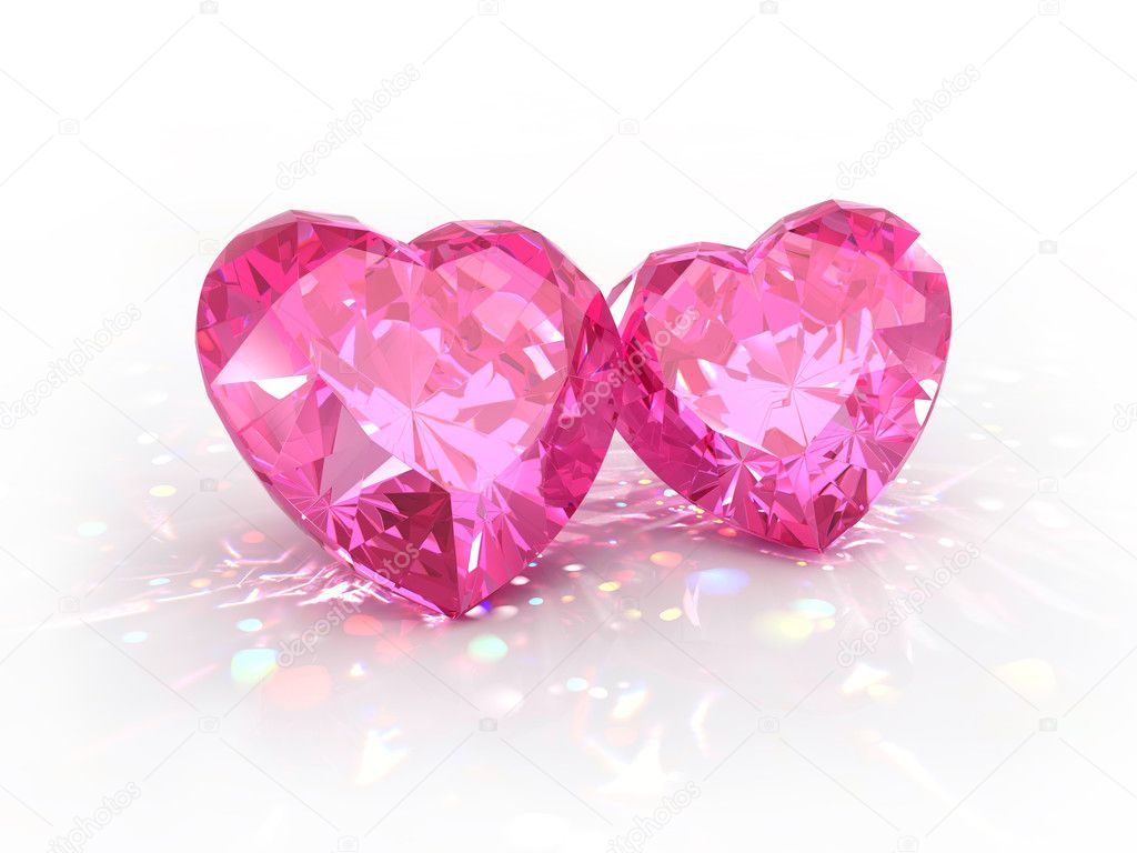 Diamonds jewel hearts for Valentines Day isolated on light background. Beautiful sparkling diamonds on a light reflective surface.