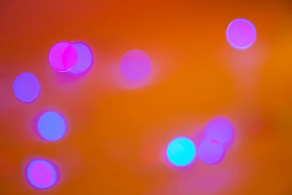 stock image Multi-colored lights on a dark background to blur