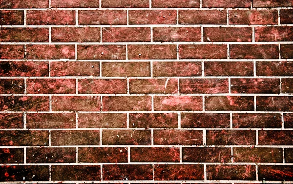 Каменная стена из красного кирпича в стиле гранжа — стоковое фото