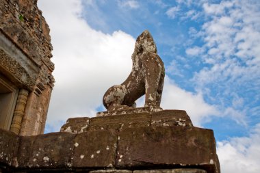 The statue of guardian lion at Pre Rup. Angkor. Cambodia. clipart